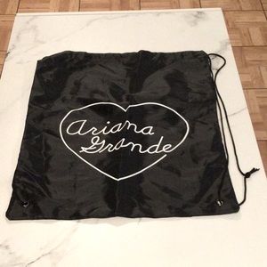 Ariana Grande black drawstring bag.